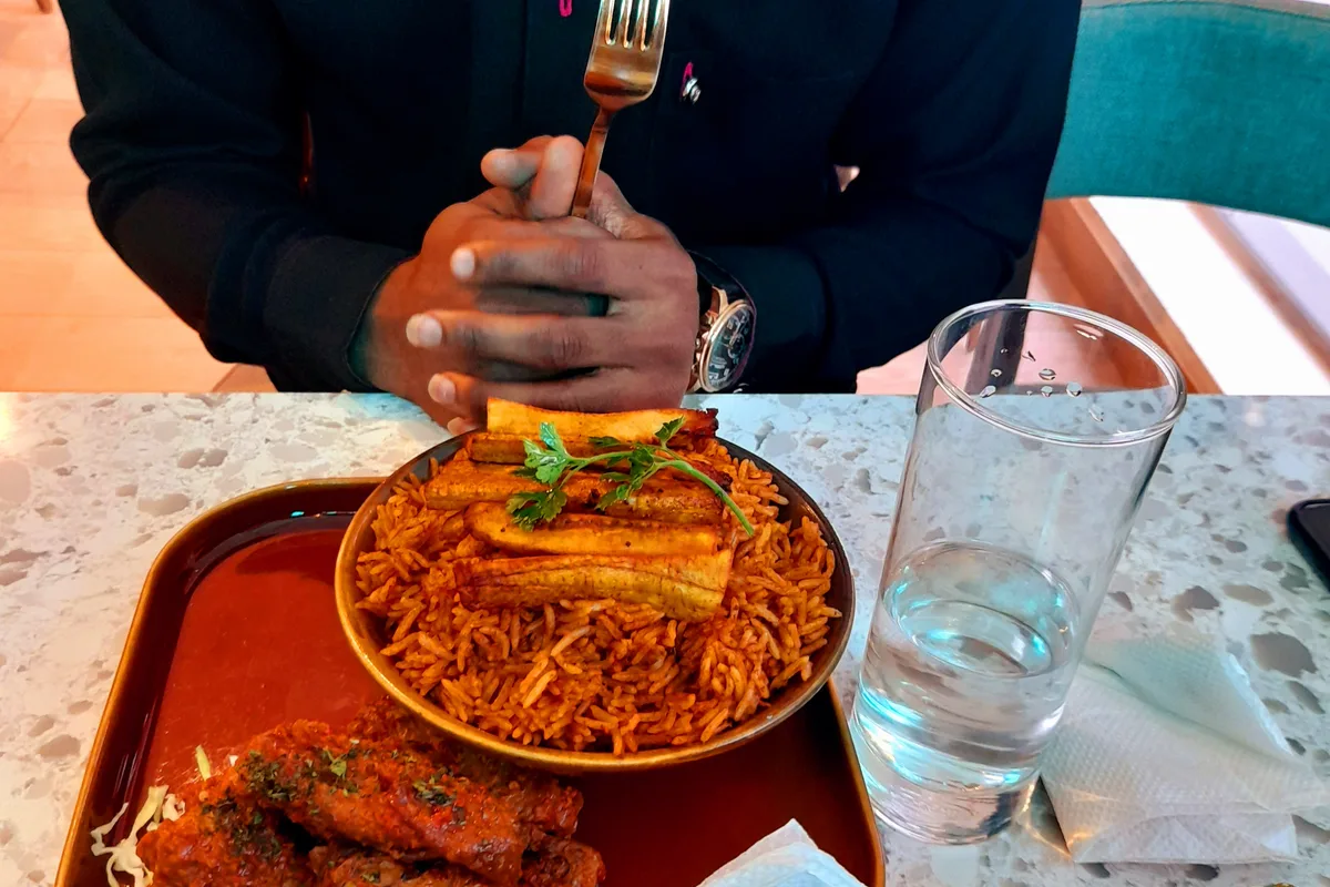 A plate of Nigerian jollof rice and fried plantain
